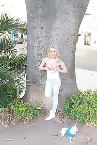 Gorgeous shemale posing outdoors and exposing her tits in public