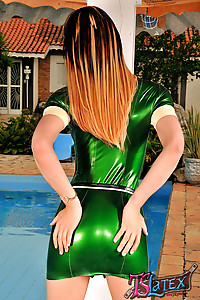 Hot shemale teases in a green latex uniform