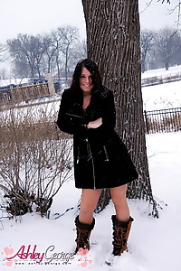 Naughty tgirl Ashley George posing outdoors in the snow
