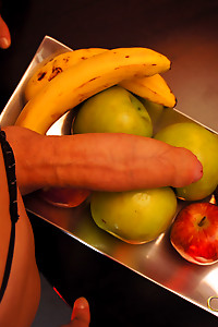 Well Hung Shemale dips her cock in a basket of fruit