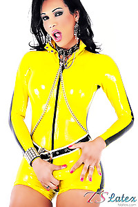 Skimpy yellow latex clad shemale babe