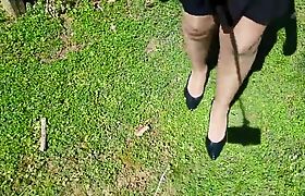 Crossdresser walking in pantyhose and high heels