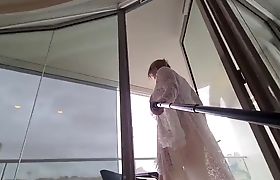 Cumming on a very public balcony